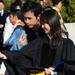 Atmospheric and Space Sciences graduate Hui-Wen Chuang and Mechanical Engineering graduate Li-Jung Tai, both of Taiwan,  photograph themselves outside of Rackham Auditorium before walking over to Hill Auditorium for commencement on Friday morning. Melanie Maxwell I AnnArbor.com